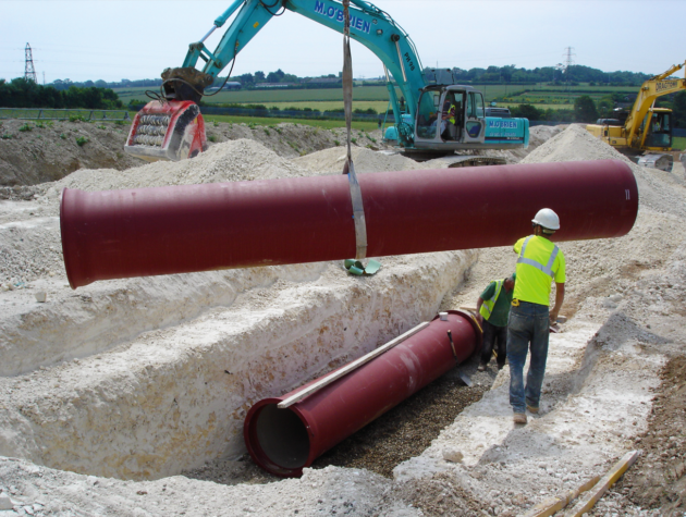 Laying ductile iron pipe from Hambaker Pipelines