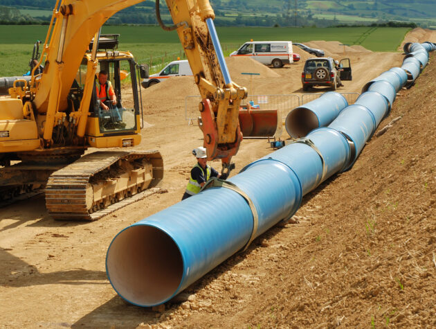 Laying ductile iron pipe from Hambaker Pipelines